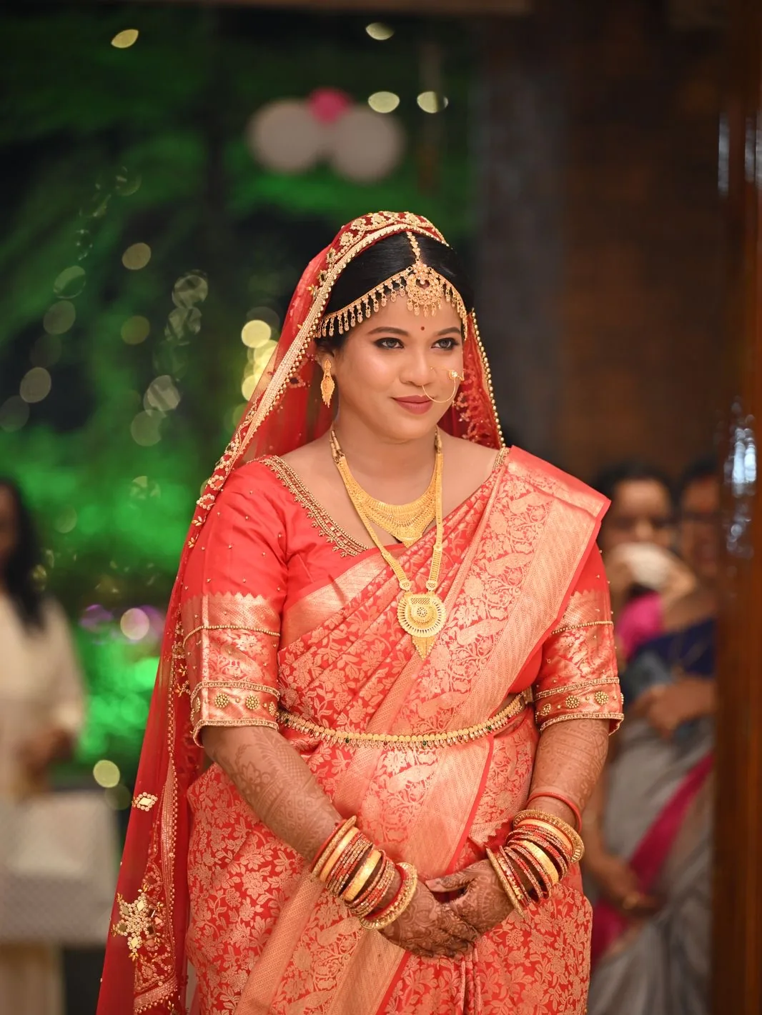Dr Arti in red Kanjeevaram silk with matha patti and gold temple jewellery — bridal makeup in Bhubaneswar by Romma