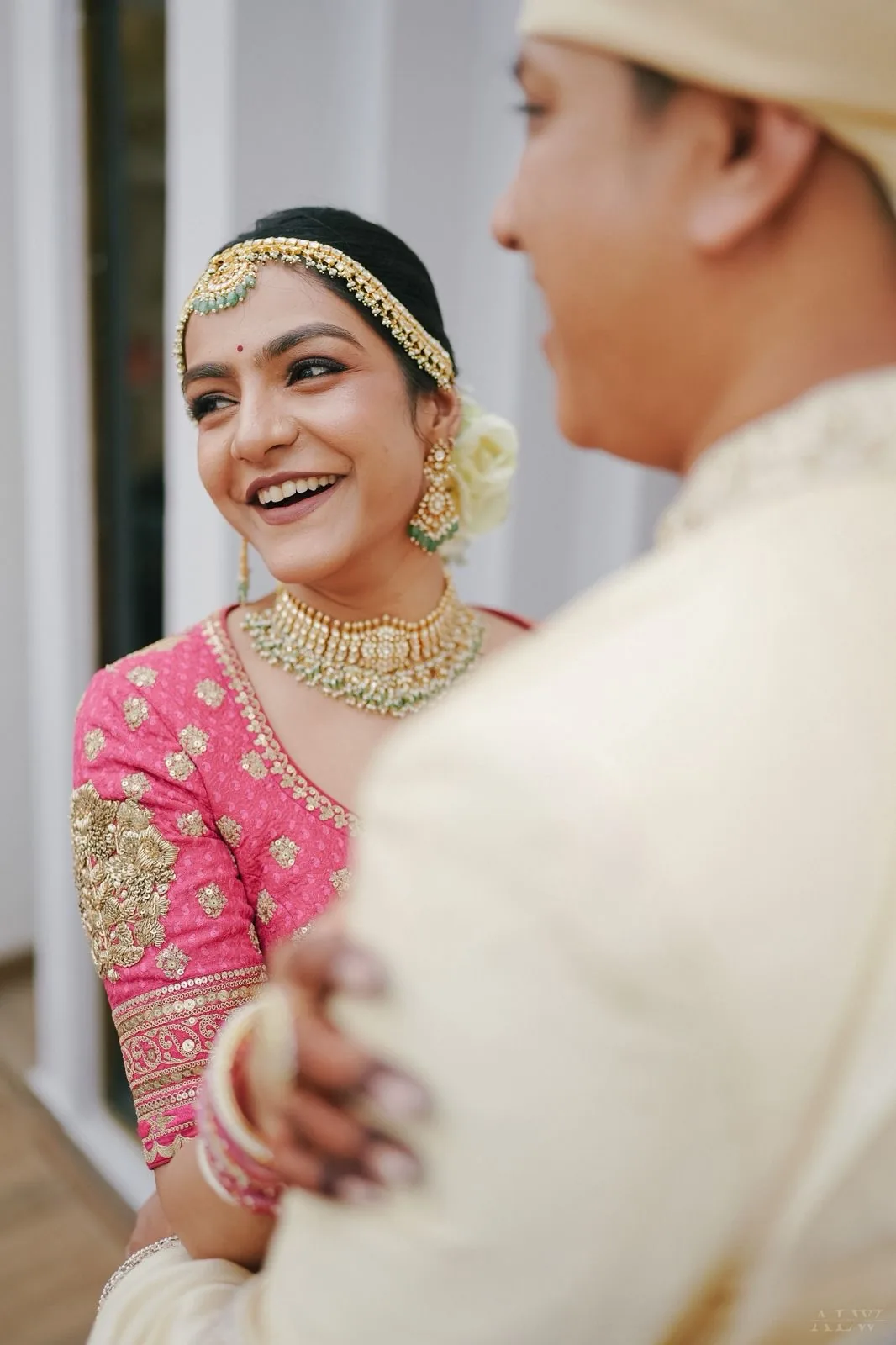 Bhubaneswar bride makeup by Romma — bride laughing with her groom